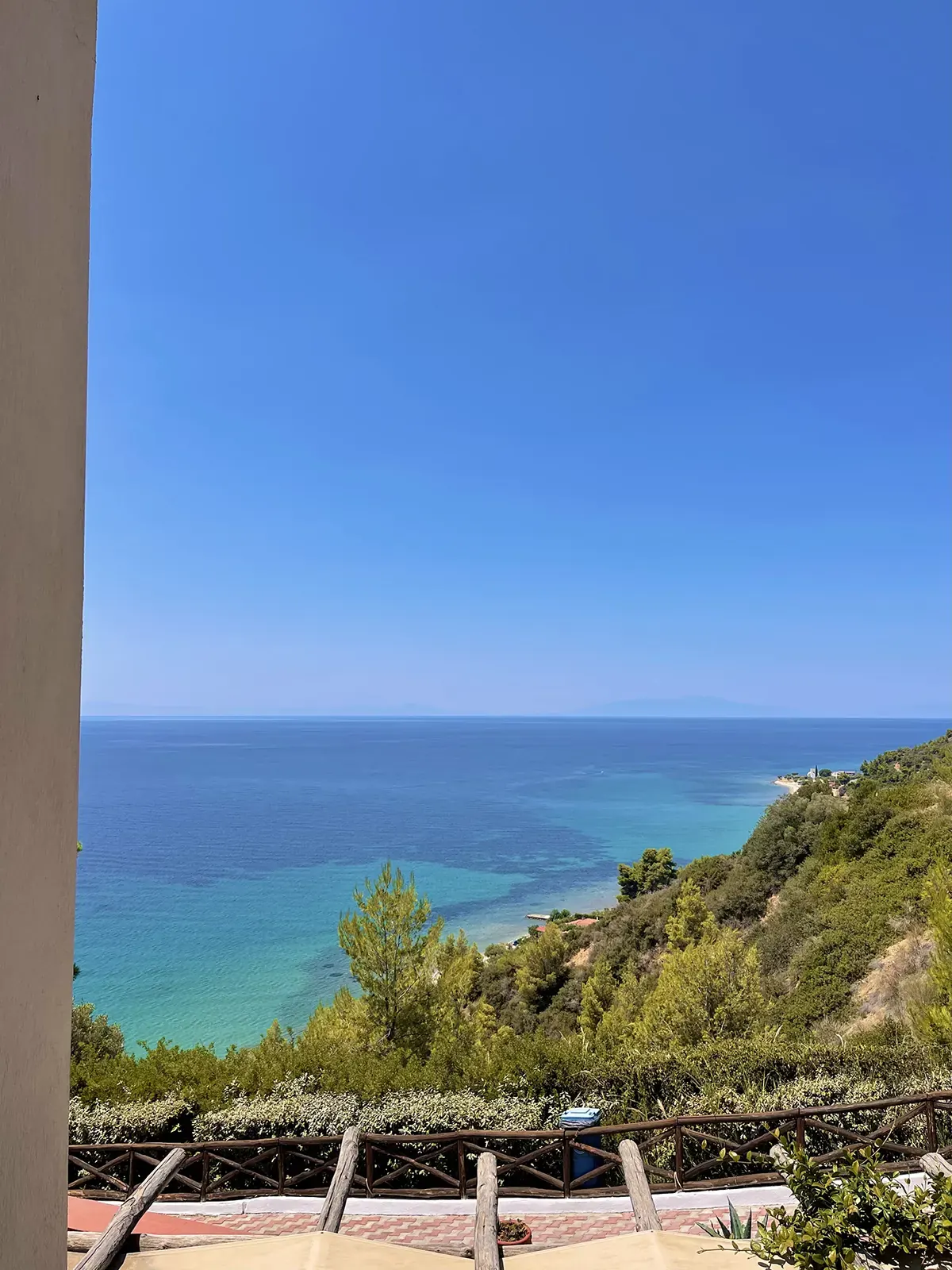The Aegean from the hillside at midday, green slopes below
