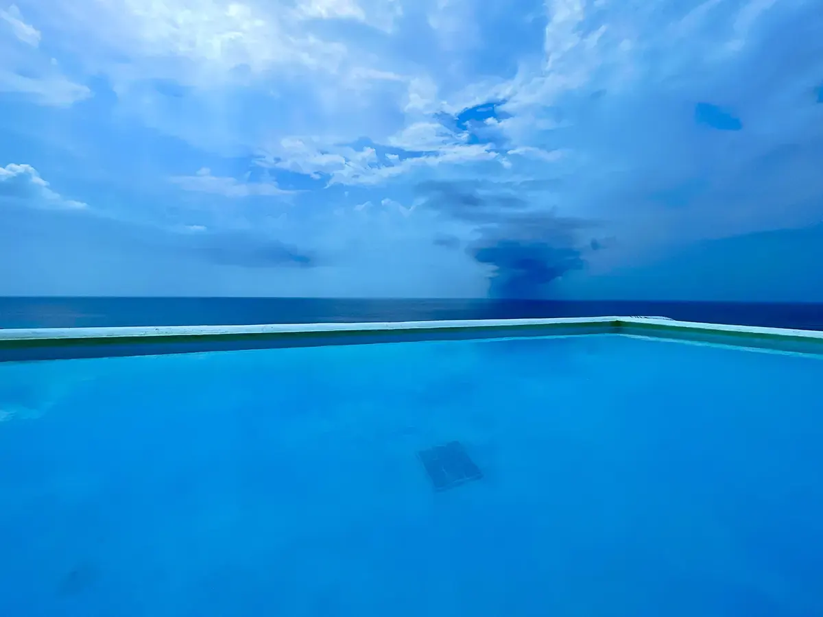 Infinity pool meeting the sky over the Aegean